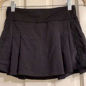 Lulu lemon stretchy tennis/biking skort. Built-in shorts. Back zip pockets
